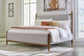 Lyncott California King Upholstered Bed with Mirrored Dresser and Chest