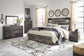 Drystan Queen Panel Bed with 2 Storage Drawers with Mirrored Dresser, Chest and Nightstand